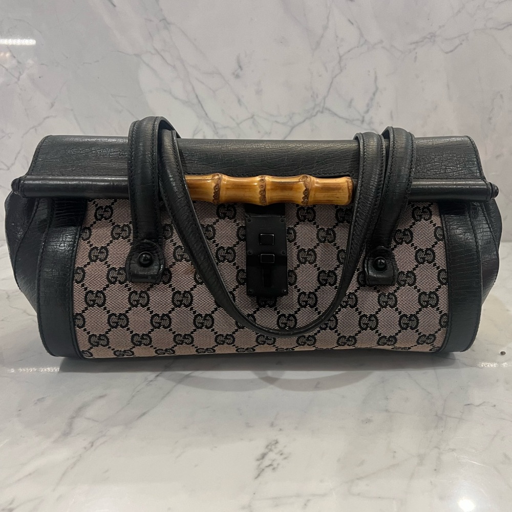 Gucci logo printed baguette shaped bag with bamboo detailing